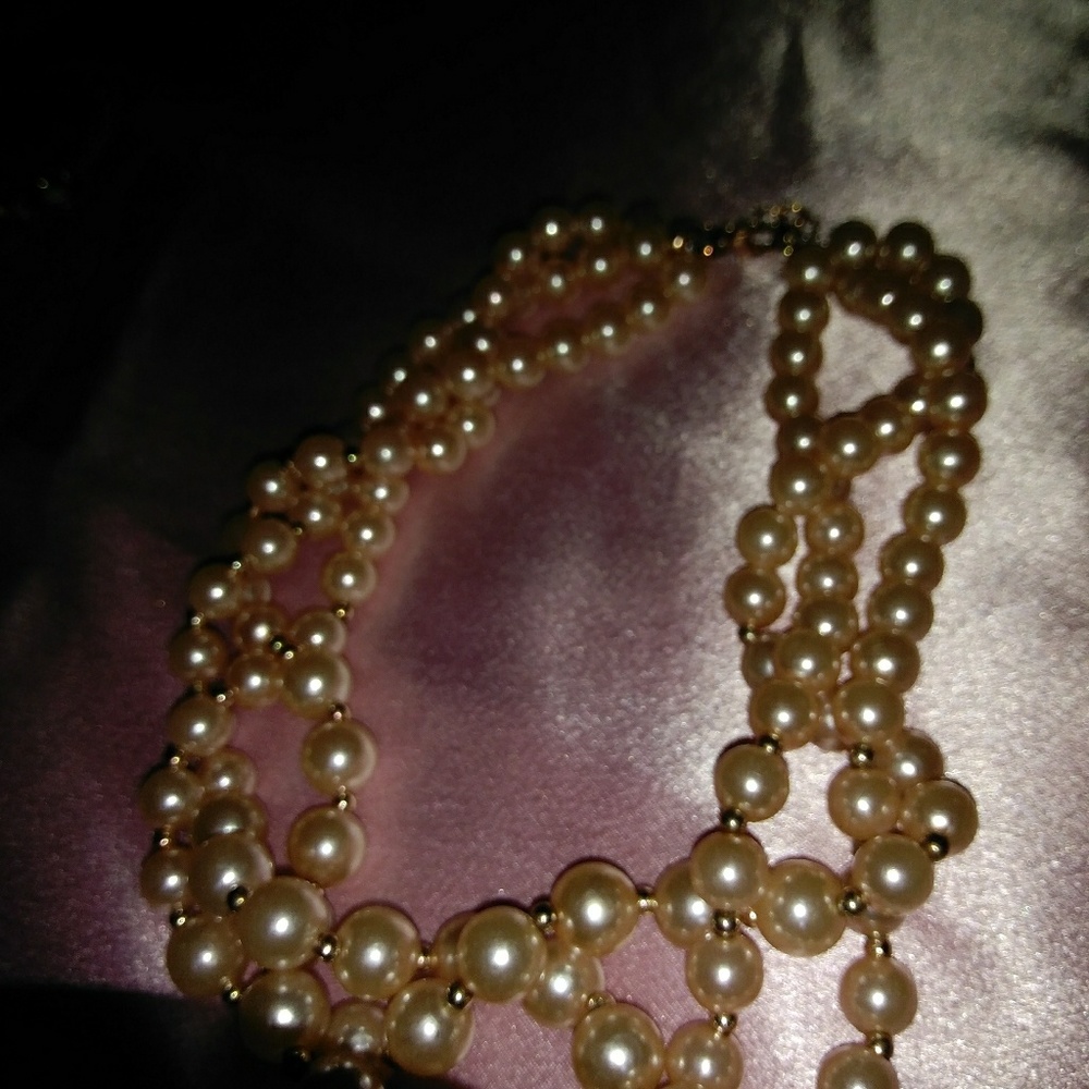 Pearls,  pink, three strands.